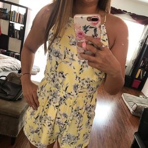 Forever 21 floral pastel yellow romper. NWT